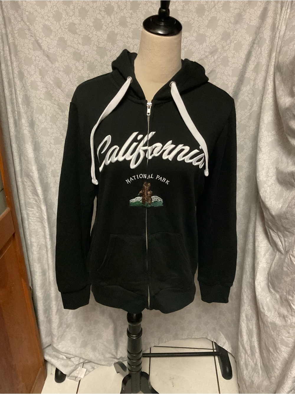 Reflex Black Zip-Up Hoodie Sweater with White Script